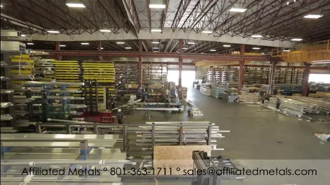 Racks of aluminum and stainless bar, tube and extrusions inside the Affiliated Metals warehouse