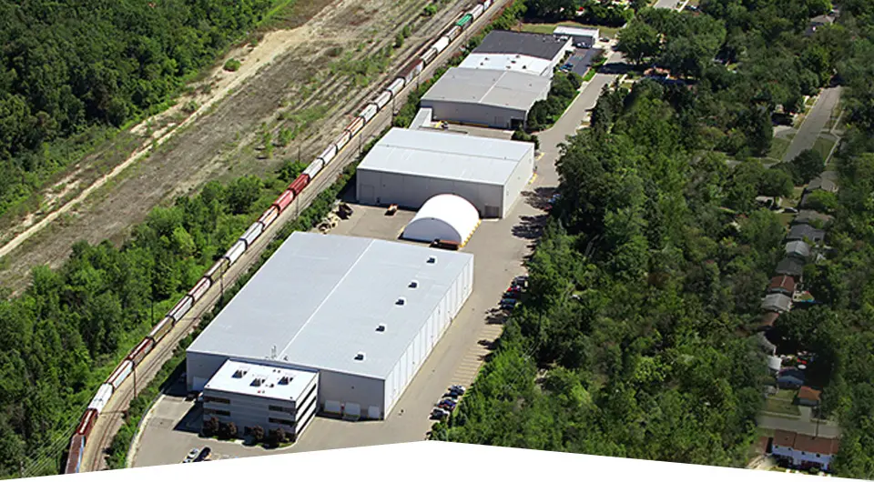 Aerial view of Aluminum Blanking Company's facility beside a rail line in Pontiac, Michigan