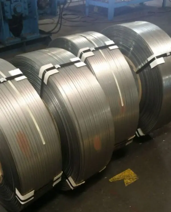 Row of banded stainless slit strip coils on the Arbor Metals plant floor before packaging