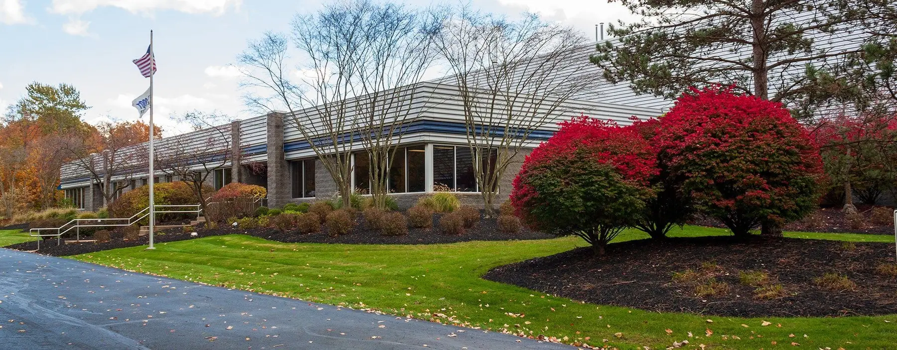 Atlas Steel's office and plant building in Twinsburg, Ohio, with landscaped entrance
