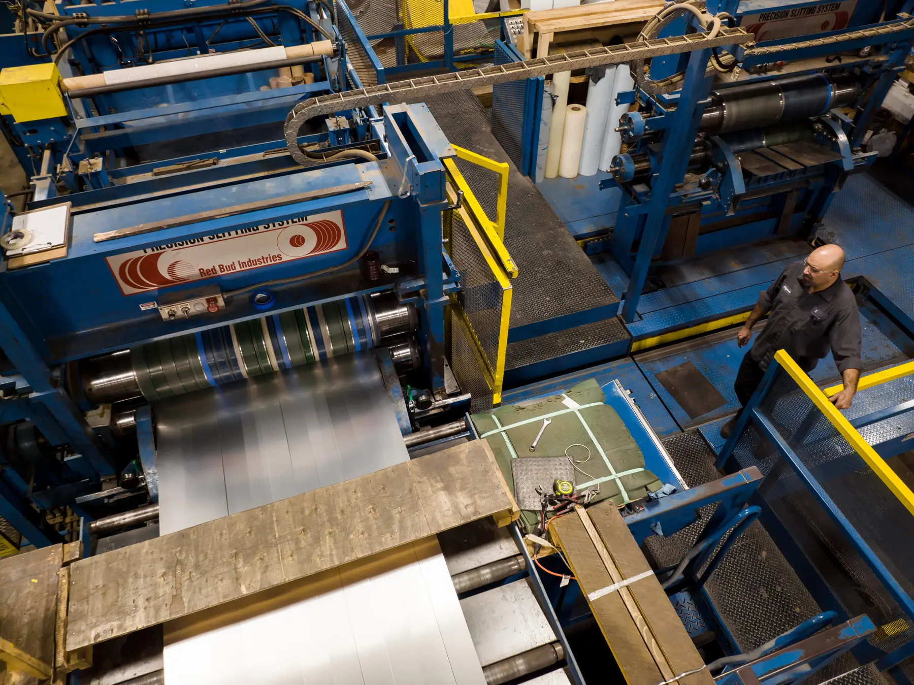 Slitting line separating metal strip into narrow mults at Basic Metals