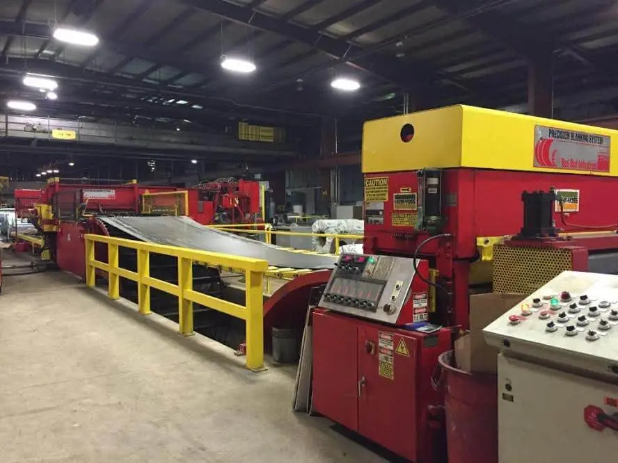 Red Bud precision blanking line with Herr-Voss leveler running coil on Beaver Steel's plant floor