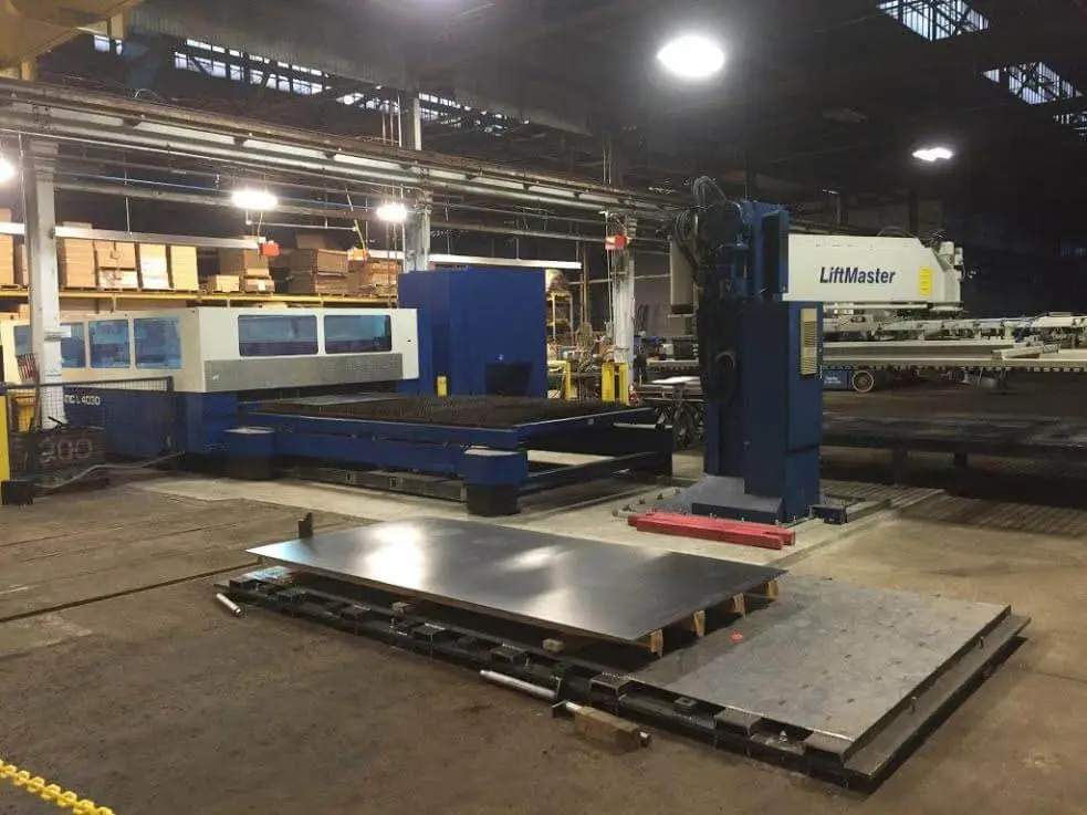 Trumpf laser cutting system with a steel plate staged on the load table at Beaver Steel