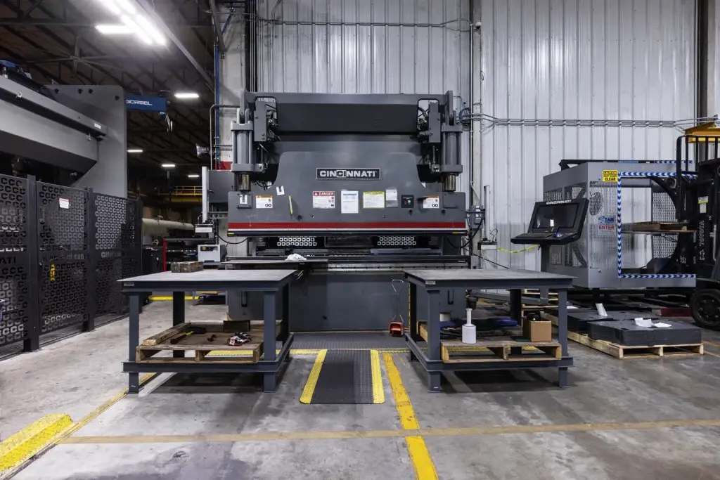 Cincinnati CNC press brake with work tables on the Central Plains Steel shop floor