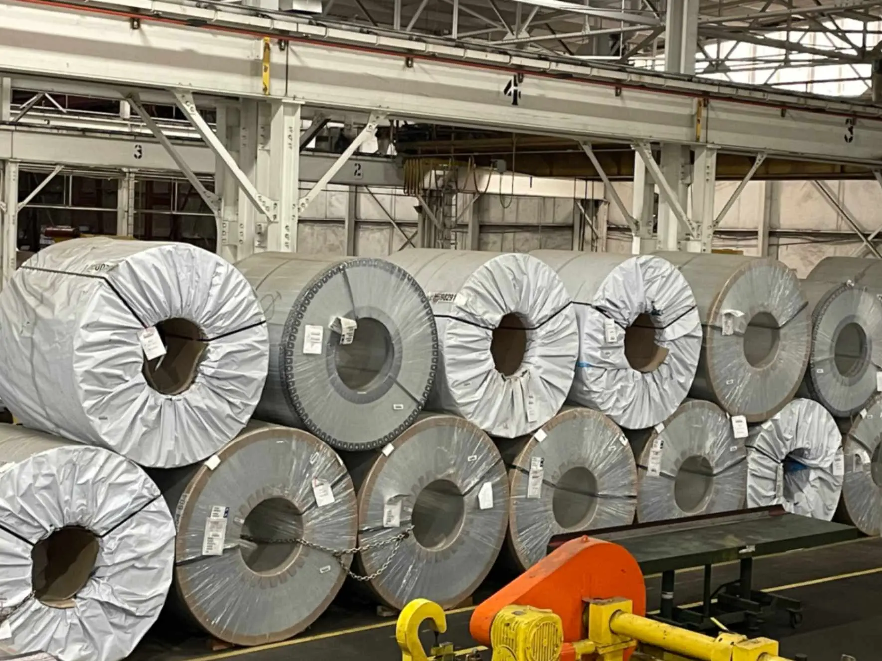 Wrapped steel coils stacked two high in the Chesterfield Steel warehouse in Cleveland