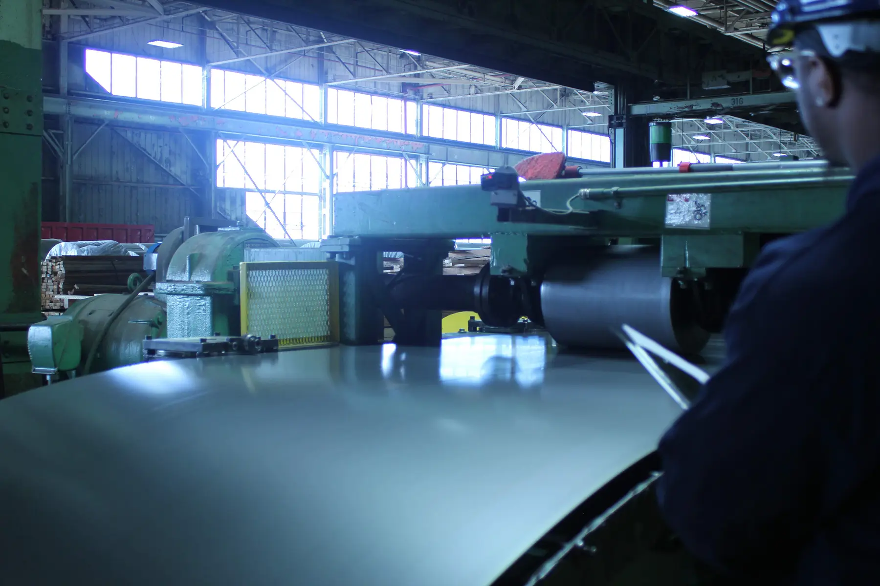 Steel strip running through Chicago Steel's cut-to-length line in the Gary, Indiana plant