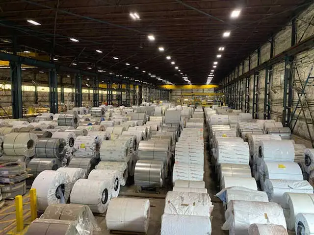 Rows of wrapped steel coils stored in the Coilplus Pennsylvania warehouse