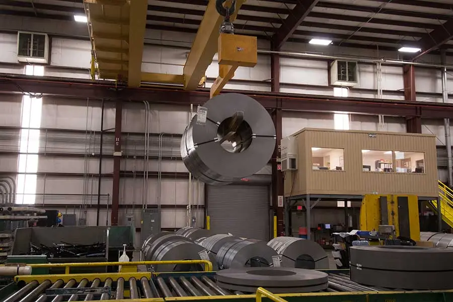 Steel coil on a processing line inside the Coilplus Texas plant