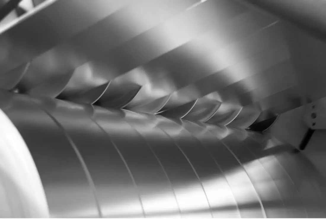 Narrow stainless steel strands coming off a precision slitter