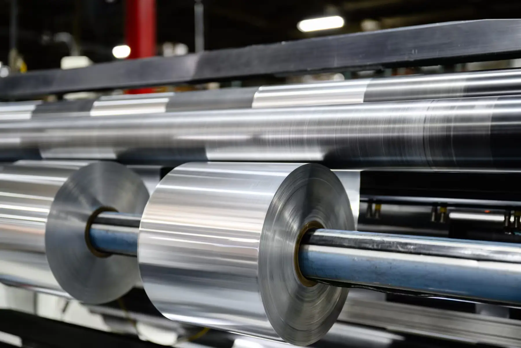 Aluminum foil coils being slit and rewound on a Comet Metals slitting line