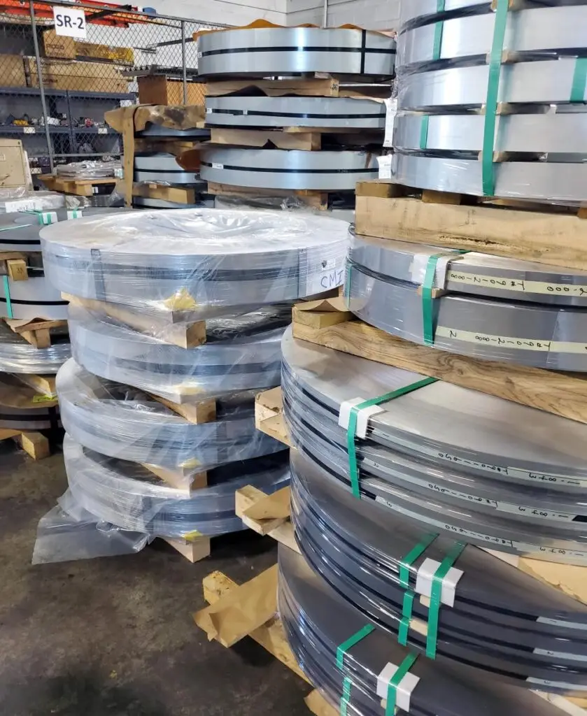 Banded narrow slit coils stacked on skids in the Consolidated Metal Service plant