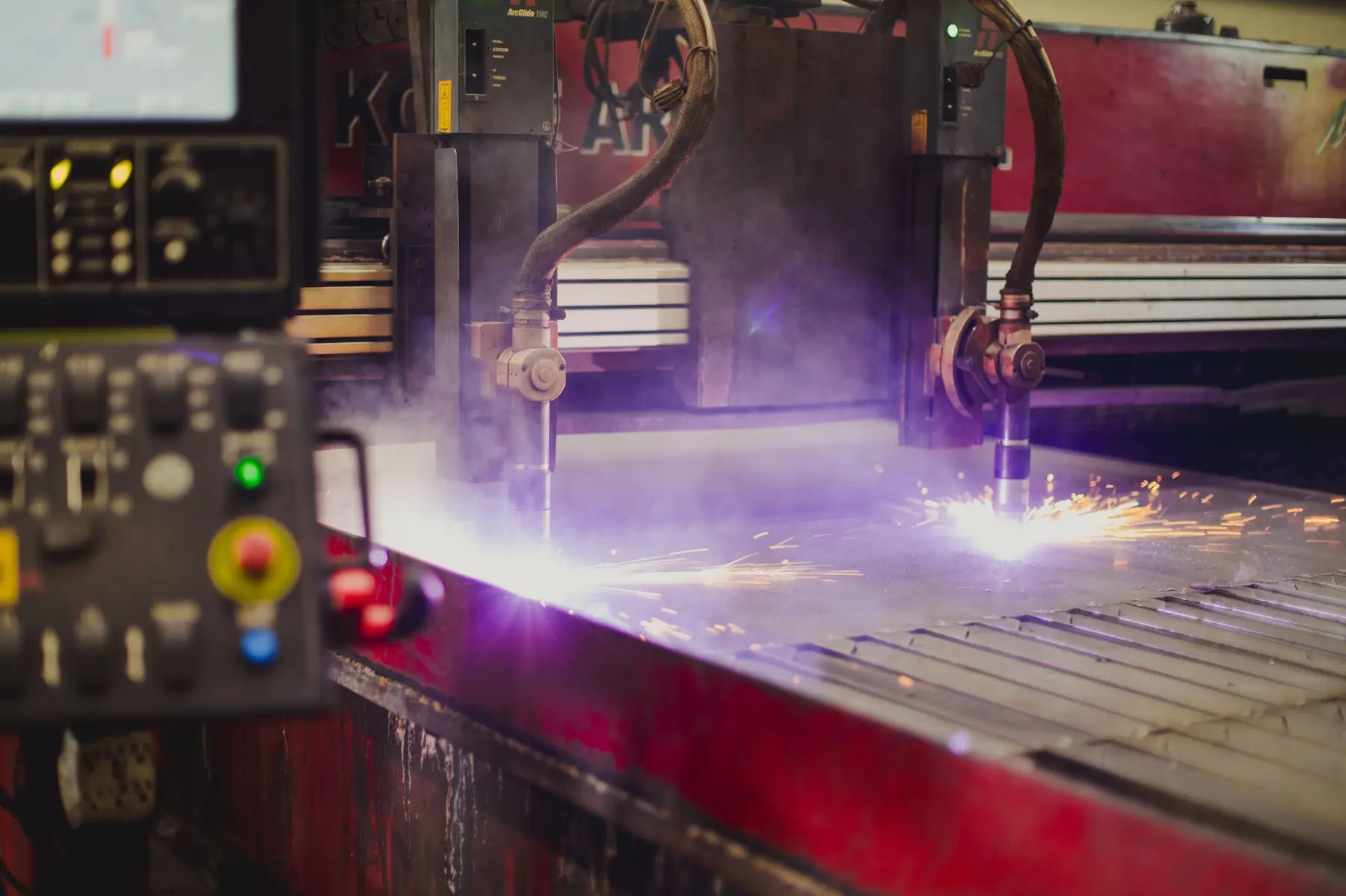 CNC plasma cutting table cutting steel plate at Coosa Steel in Rome, Georgia