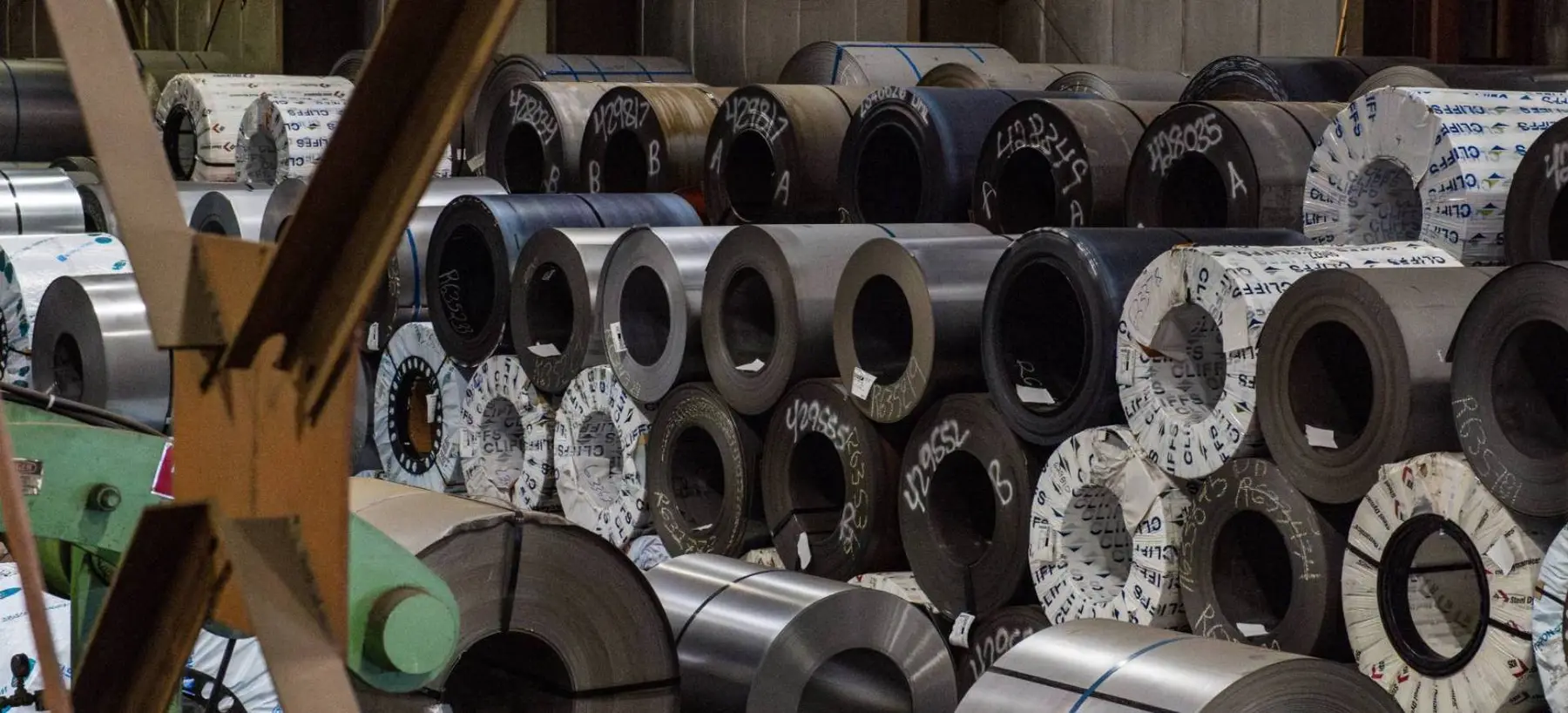 Stacked hot-rolled, cold-rolled and coated steel coils in Dalco's warehouse