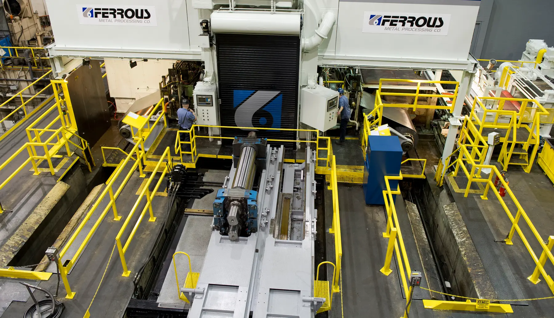 Four-high reversing cold mill with walkways and coil handling at Ferrous Metal Processing in Brooklyn, Ohio
