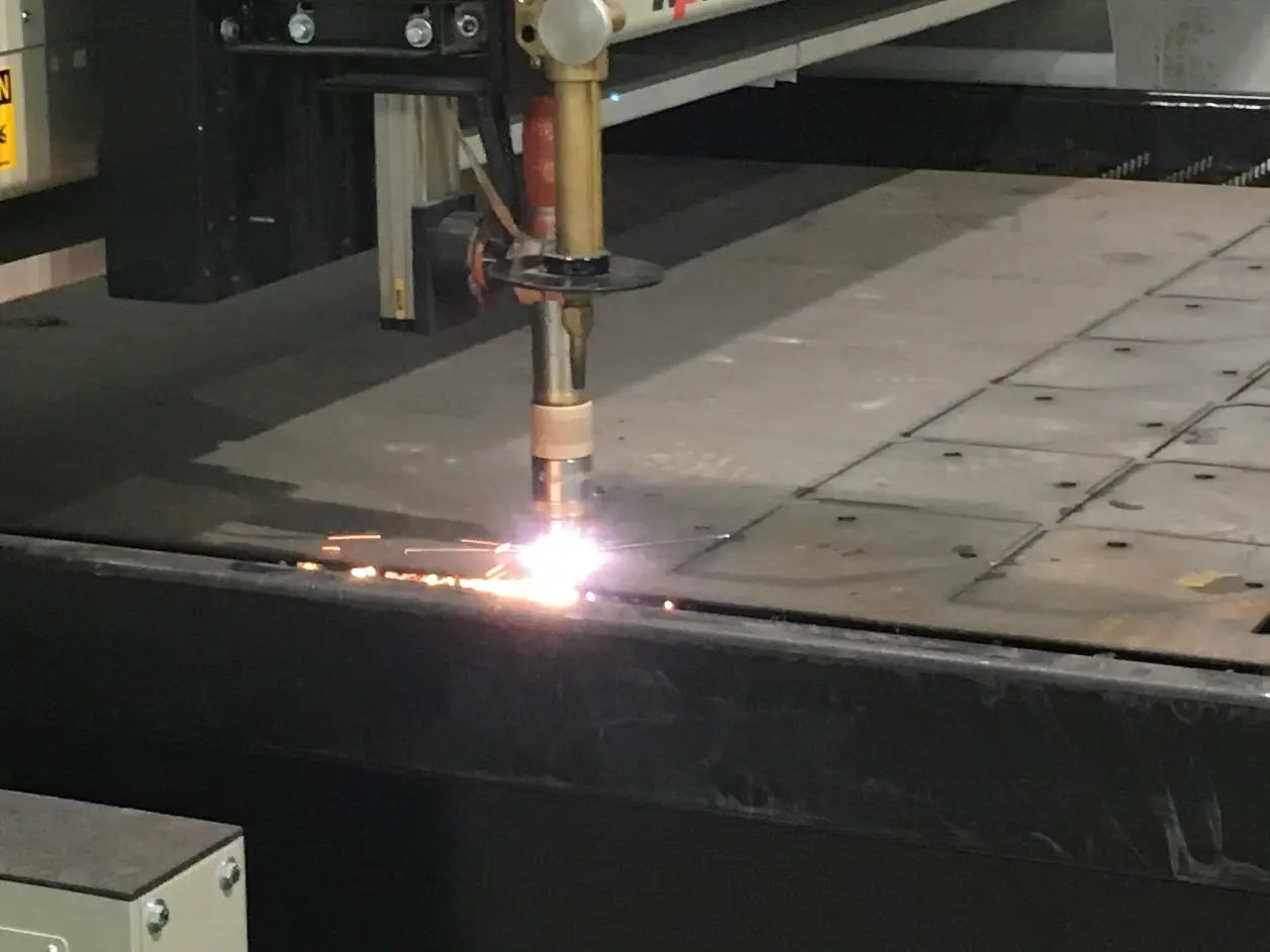 Glosser Steel's high-definition plasma torch cutting steel plate on the cutting table
