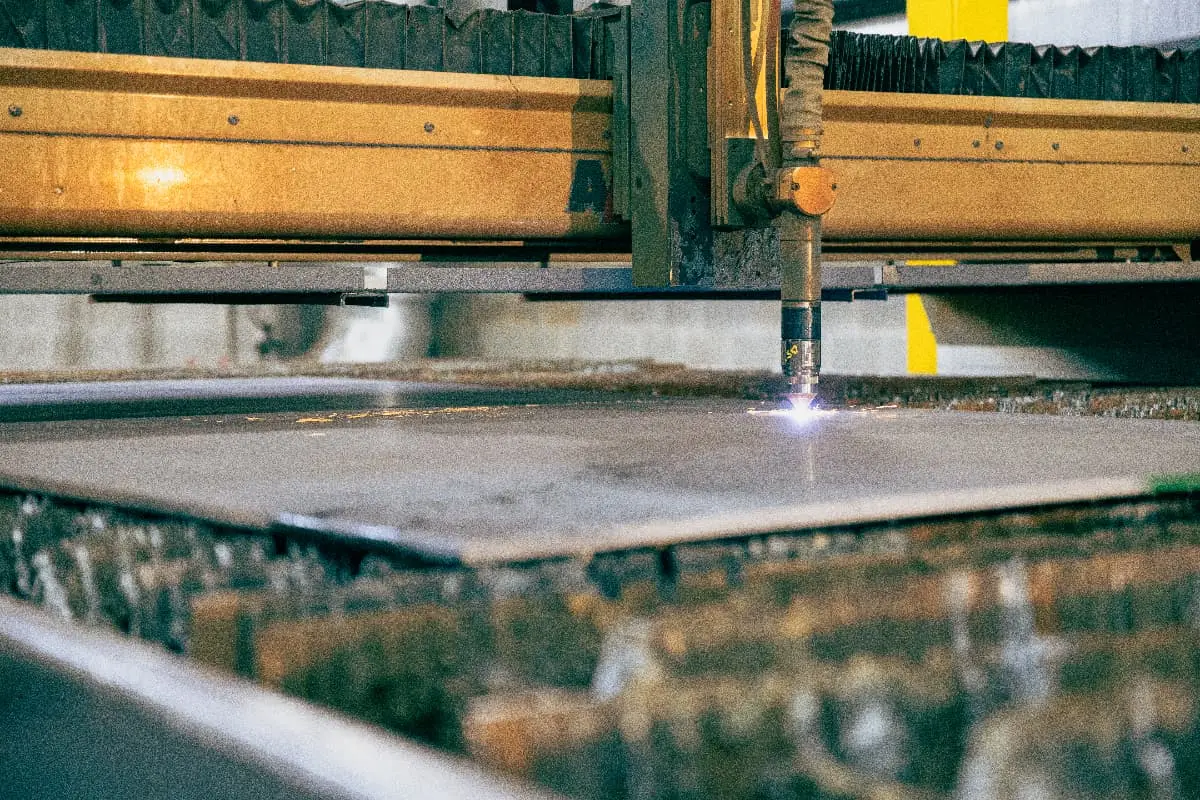 Plasma torch cutting steel plate at a Harbor Steel processing table