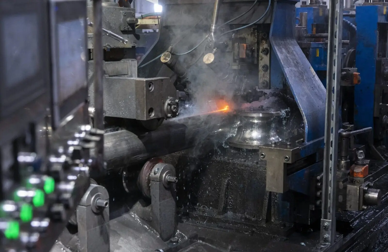 Tube mill forming and welding steel tube with sparks at the weld station