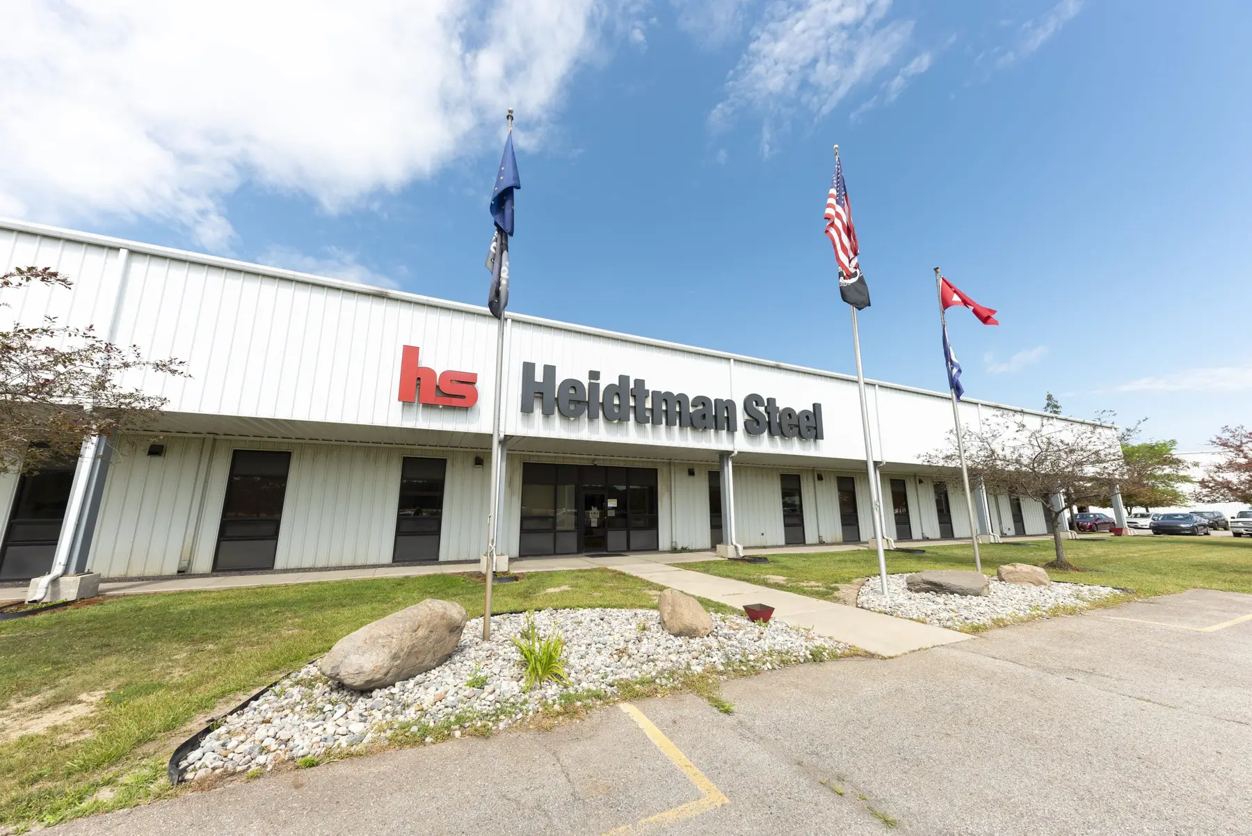Front entrance of the Heidtman Steel plant in Butler, Indiana with flags