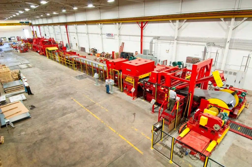 Overhead view of a High Steel Service Center coil processing line with stacked finished sheet