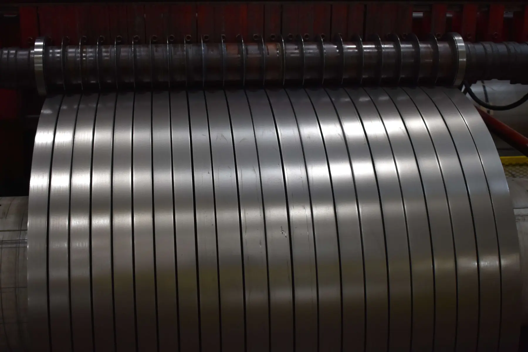 Freshly slit steel mults winding onto the recoiler of a Horizon Steel slitting line