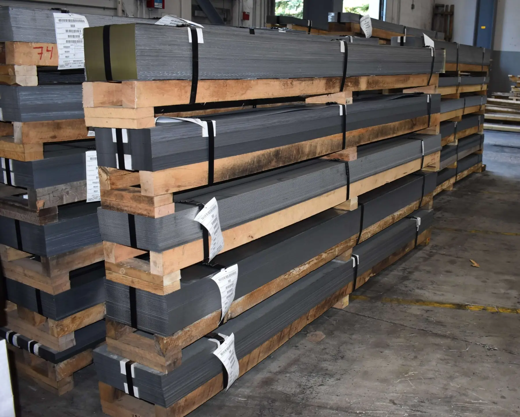 Banded bundles of cut-to-length steel sheets on custom wood skids