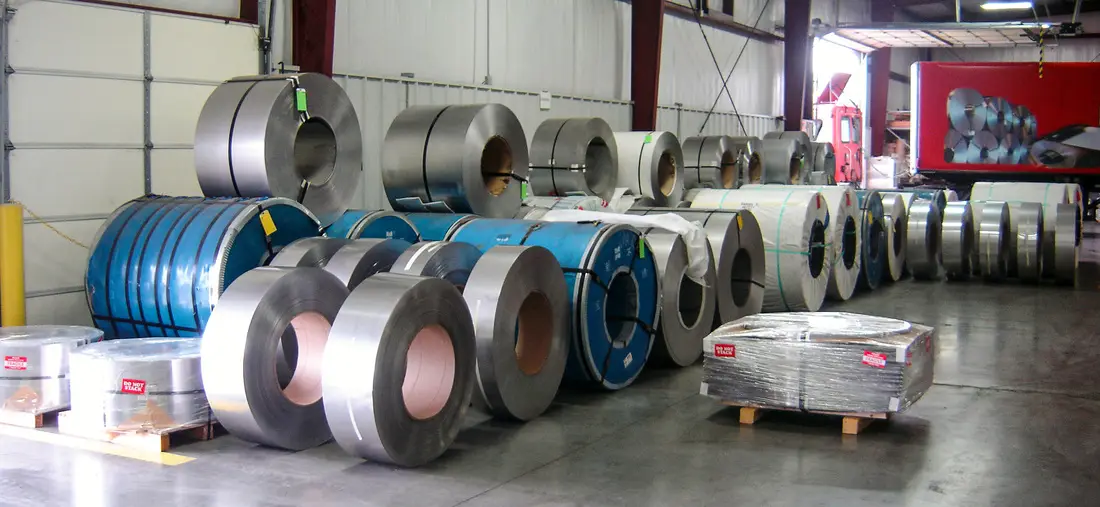 Master coils and slit coils staged on the warehouse floor at HSK Stainless