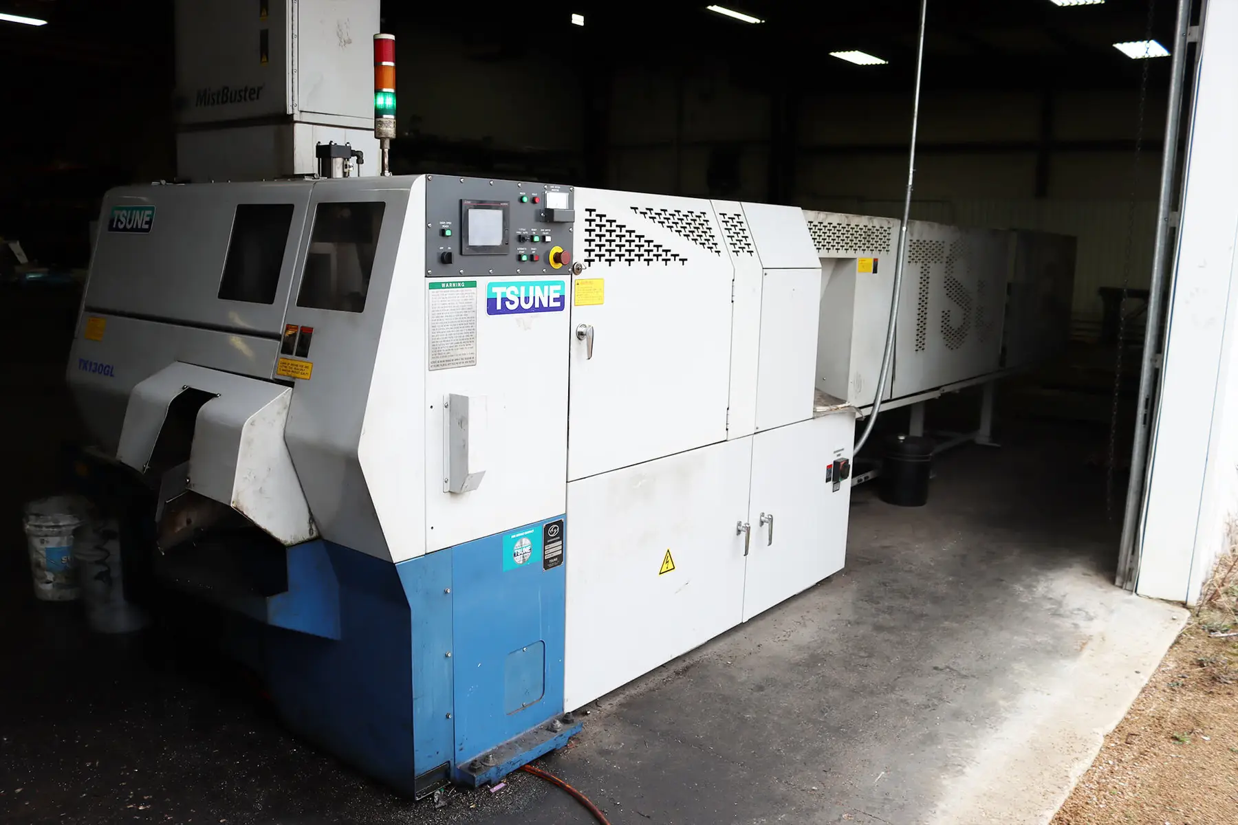 Automatic production saw used for cut-to-length bar cutting inside the Integrated Metals warehouse in Tulsa