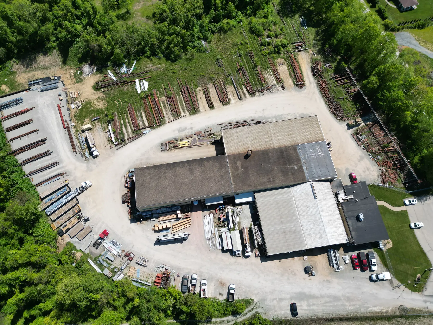 Aerial view of the Jeannette Steel & Supply yard in Grapeville with racked structural steel and buildings