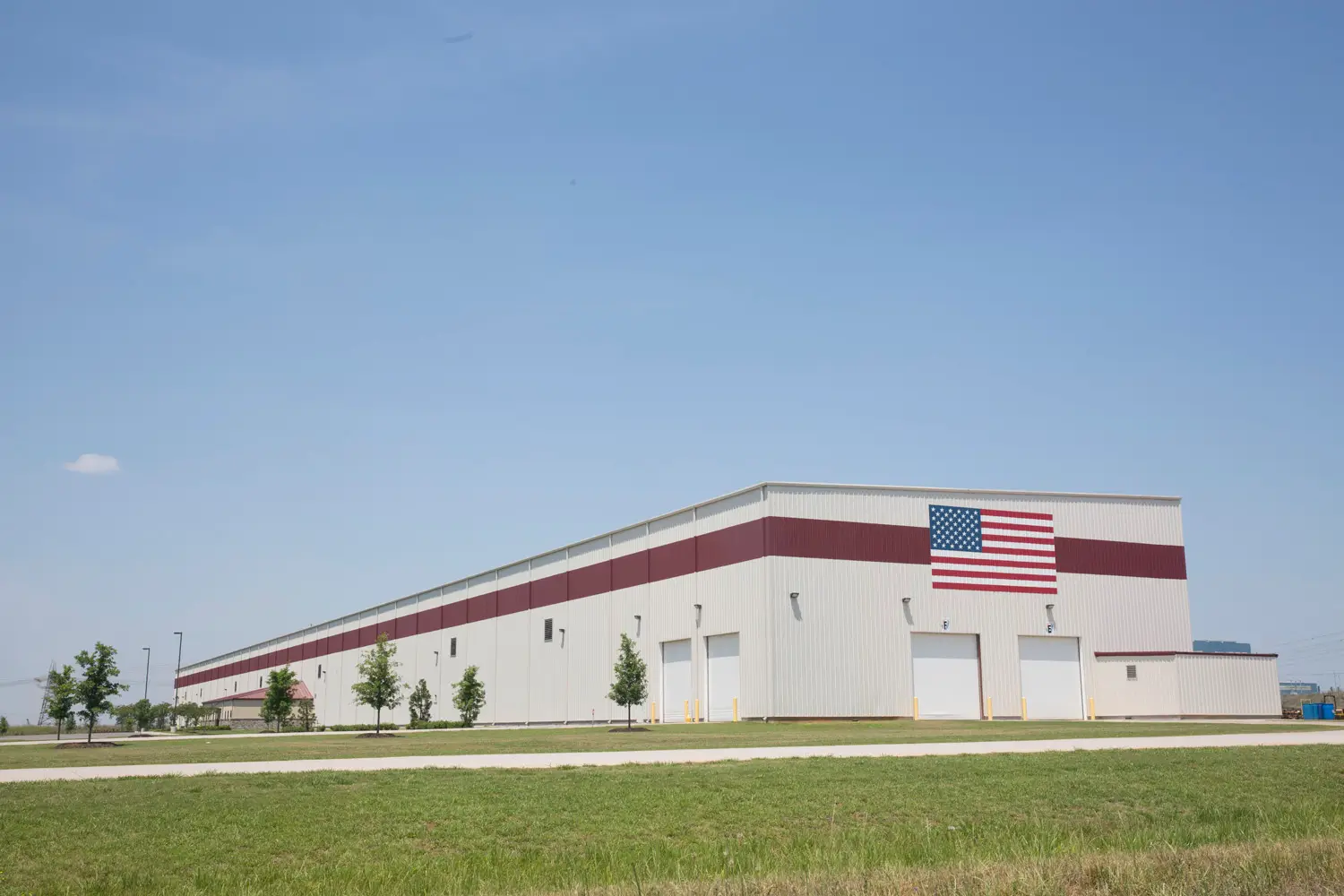 Jemison Metals' Decatur, Alabama steel service center with American flag on facade
