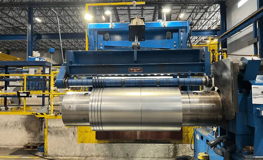 Braner 72-inch slitting line recoiling freshly slit steel coil at Kloeckner Metals' University Park, Illinois branch