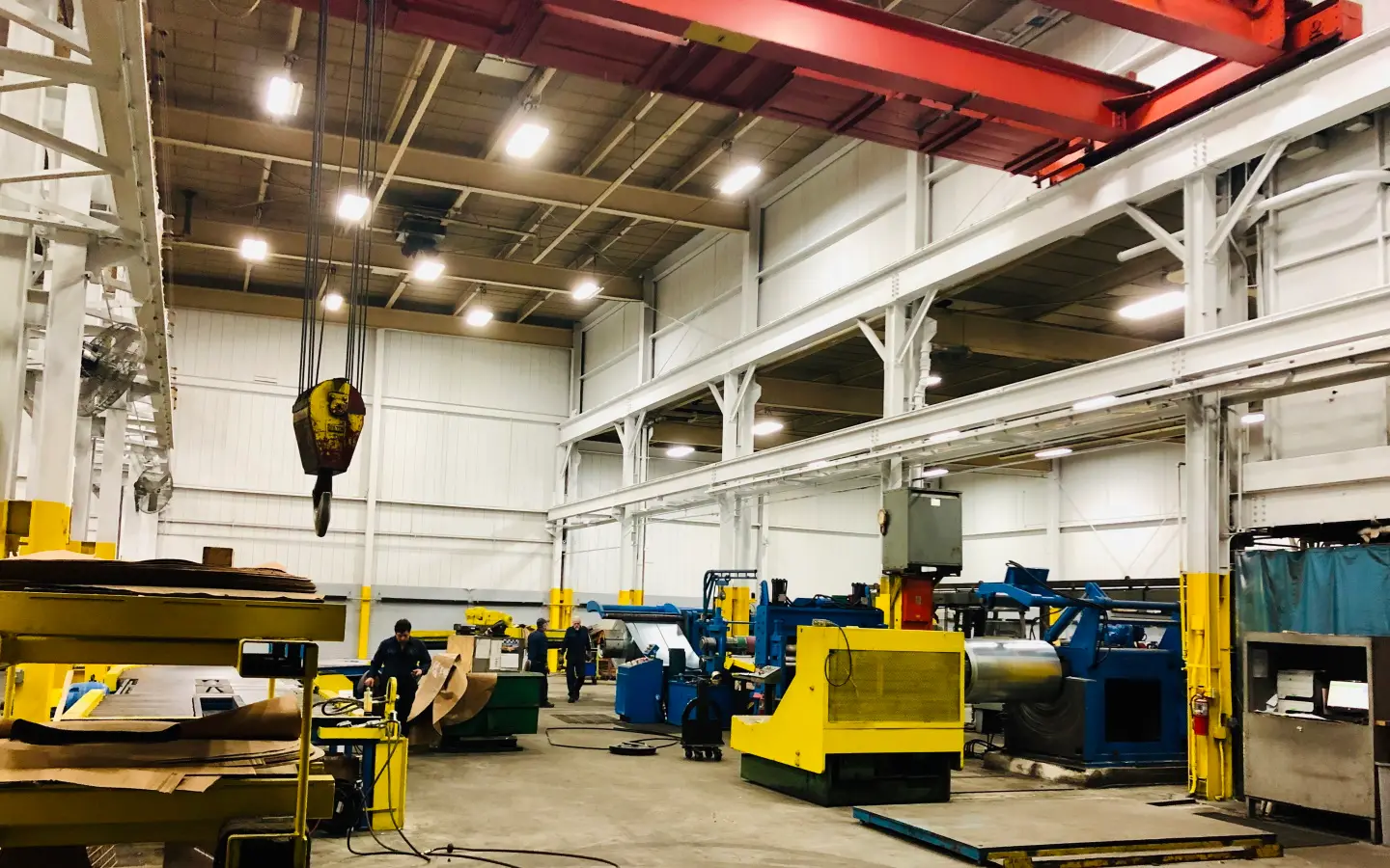Koil processing bay in Detroit with an overhead crane above coil processing lines
