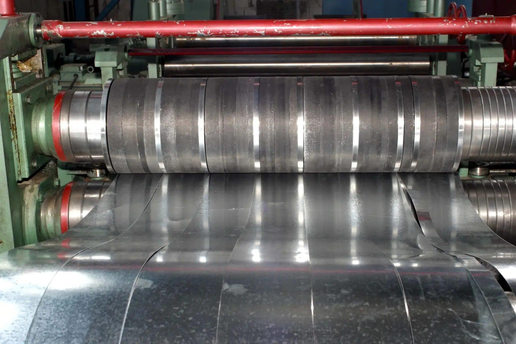 Slitter knives cutting galvanized steel coil into narrow strips