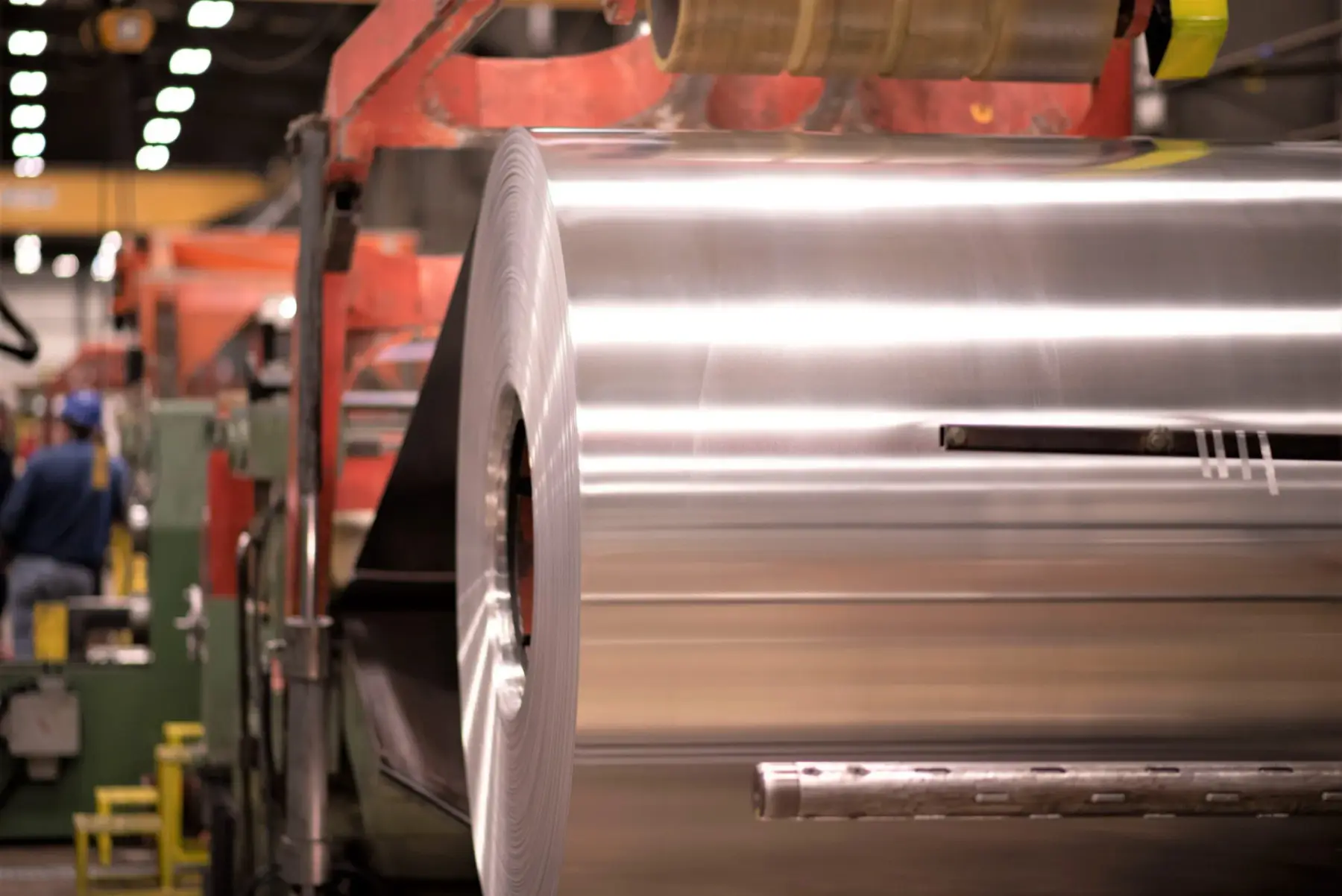 Bright stainless steel coil mounted on the entry of a LaPorte cut-to-length line