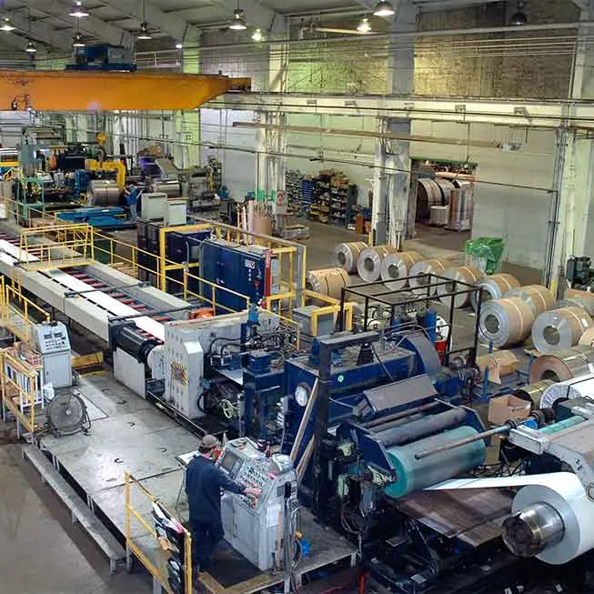Leveltek's coil-to-coil stretch leveling line with stainless coils staged on the plant floor