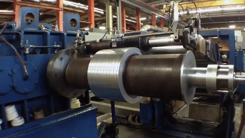 Slit aluminum coil winding on a recoiler at Lynch Metals' processing plant