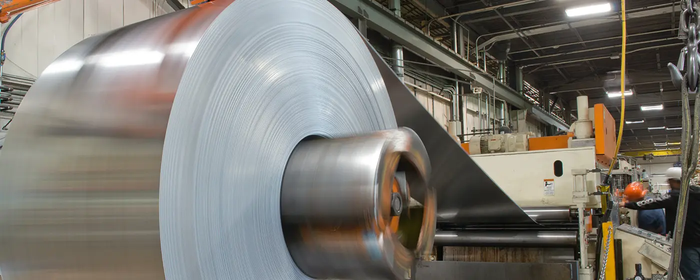 Aluminum coil unwinding on a Mandel Metals processing line