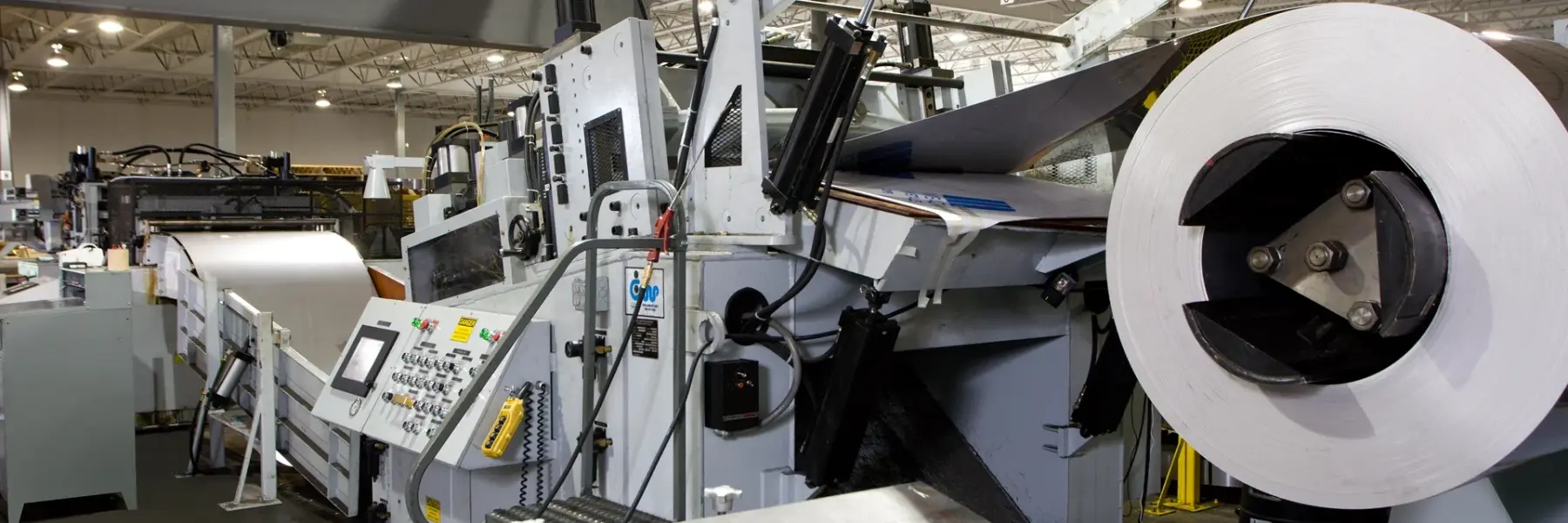 Coil loaded on the uncoiler of Mead Metals' leveling and cut-to-length blanking line