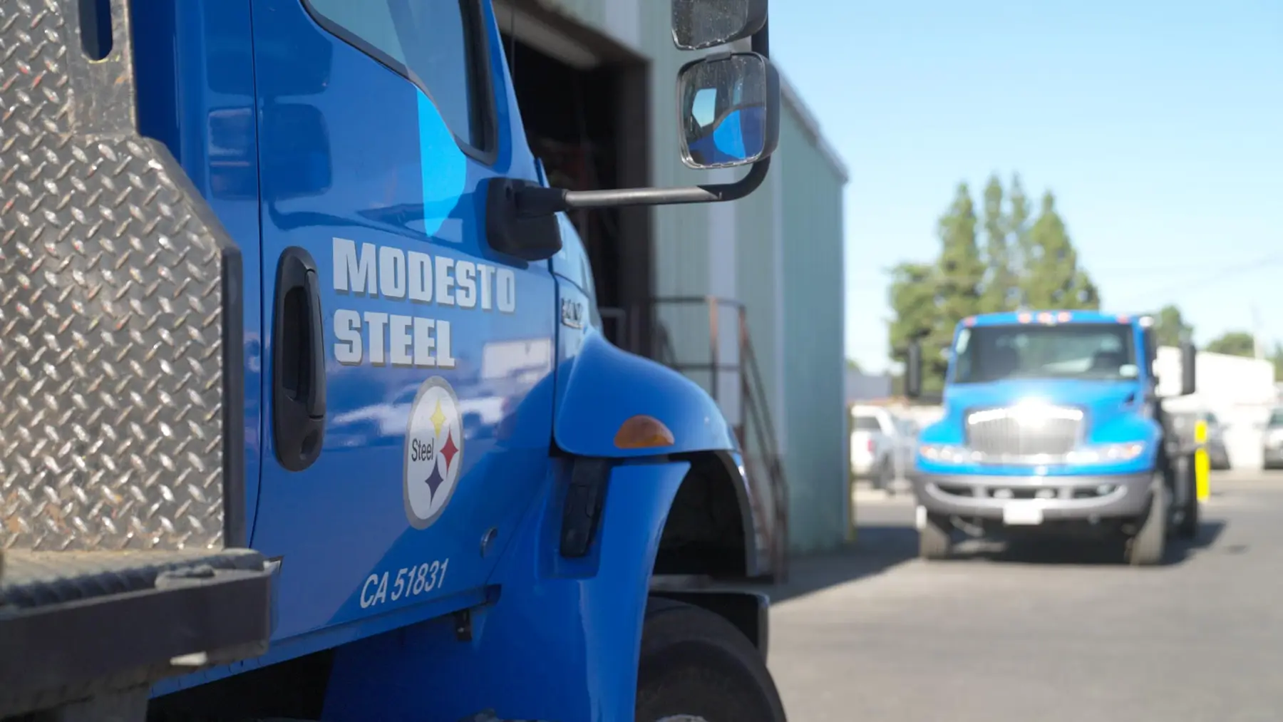 Modesto Steel delivery trucks parked at the Modesto yard