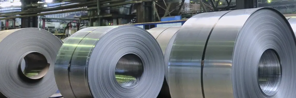 Row of steel coils on the floor of a Monarch Steel processing plant