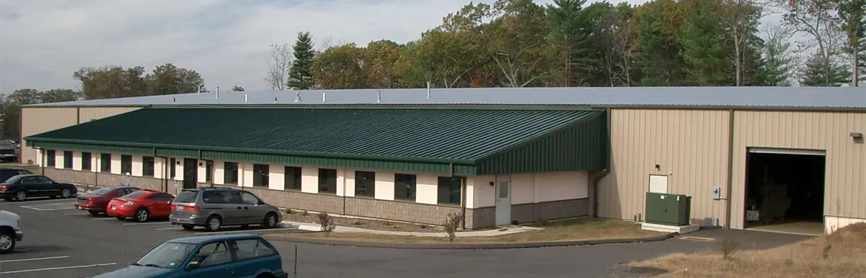 Exterior of NESSteel's 40,000-square-foot building and loading door in Tolland, Connecticut