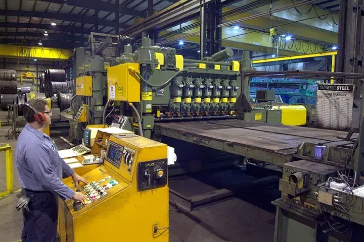Leveler and cut-to-length line with its operator control console at an Olympic Steel plant