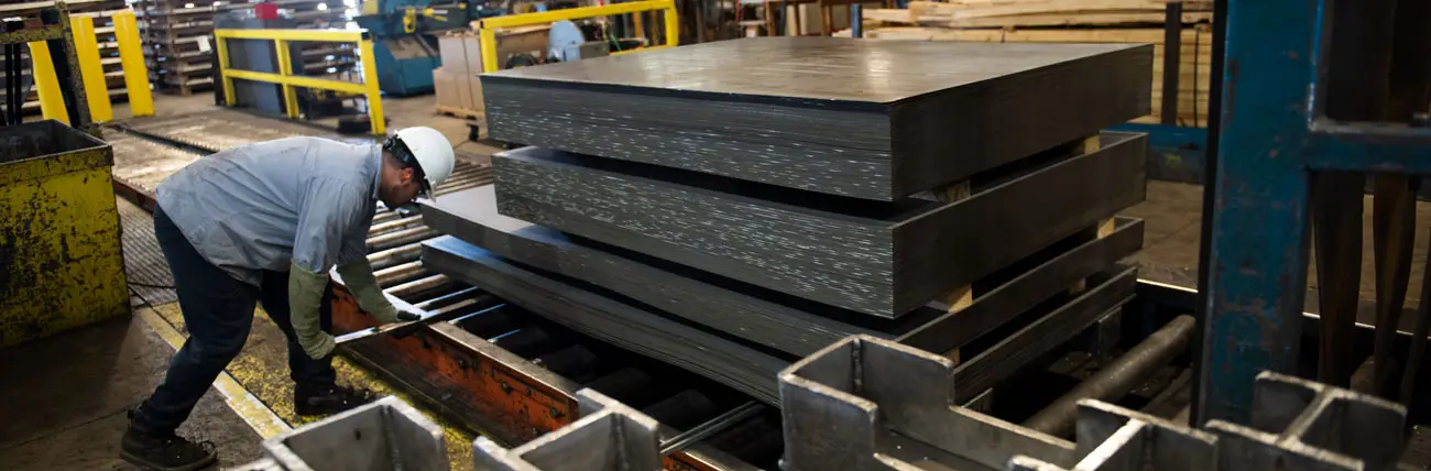Stacks of cut-to-length steel sheet at the exit end of Paragon Steel's cut-to-length line