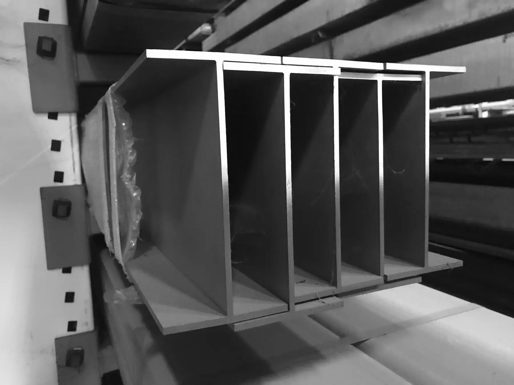 Stainless steel I-beams stored on a cantilever rack in the warehouse