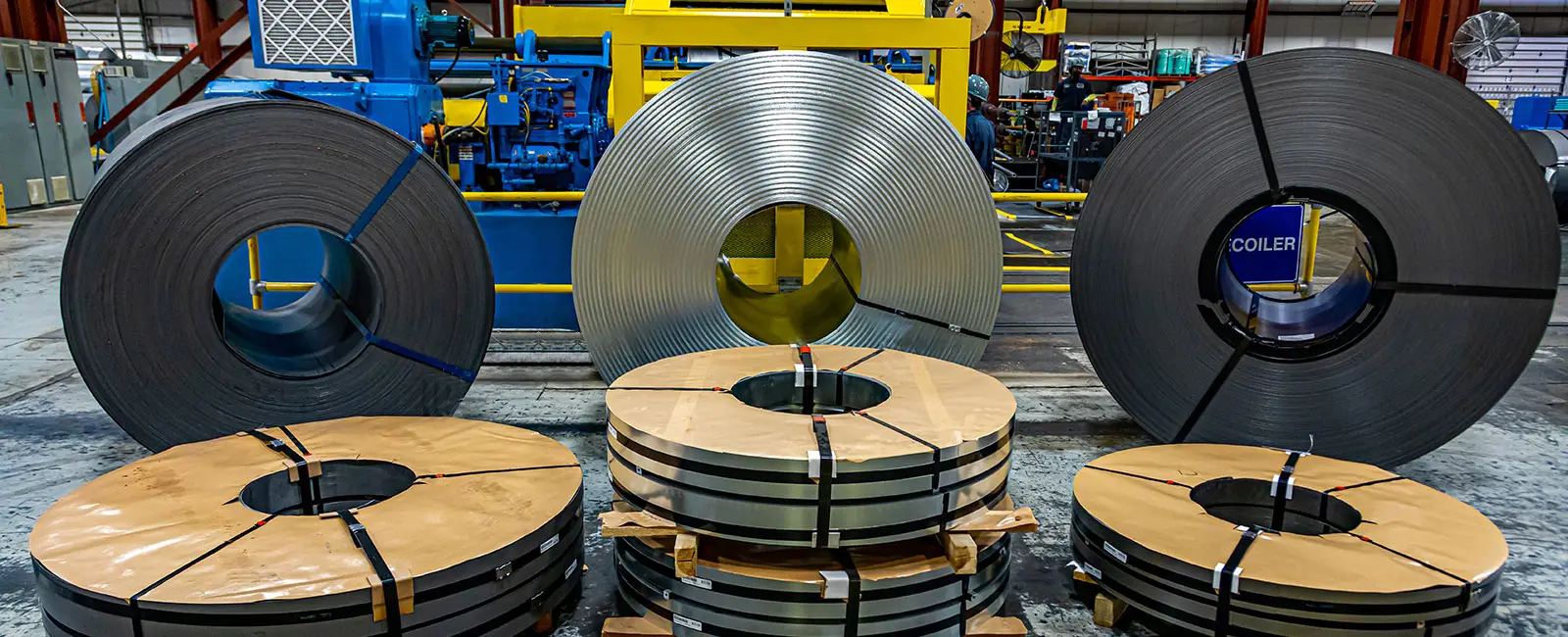 Master coils and banded slit coils staged on the processing floor at Phoenix Steel Service in Cleveland