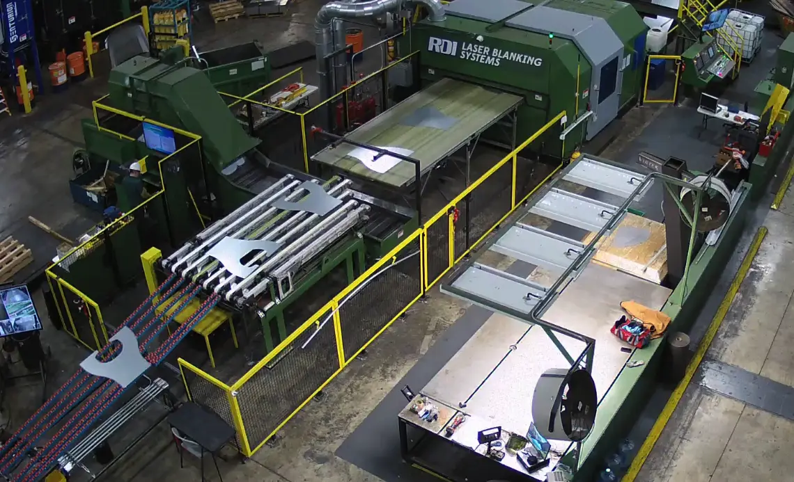 Overhead view of the coil-fed laser blanking line and blank stacking area