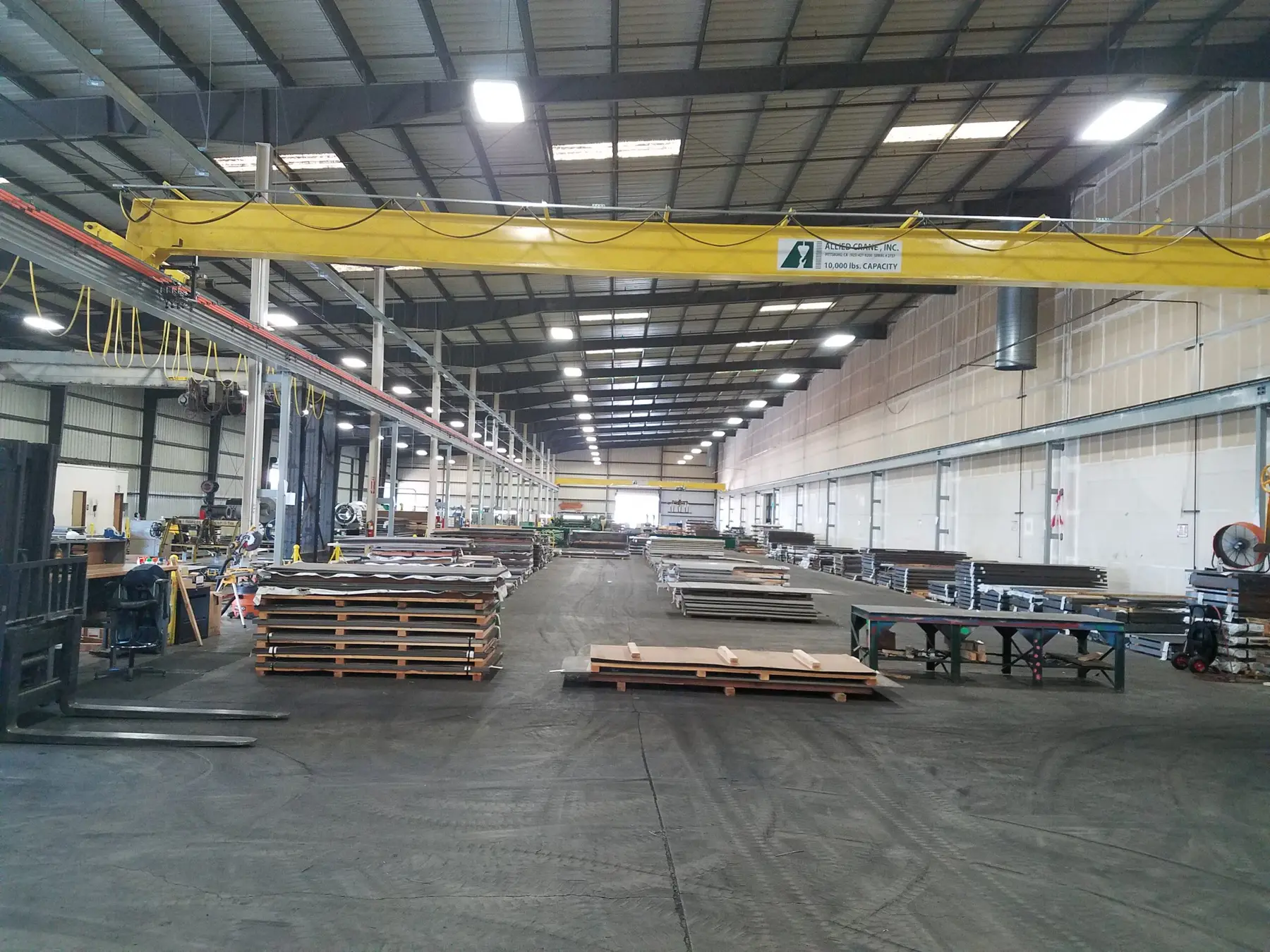 Sheet processing bay at Reliance Sheet & Strip in Antioch with an overhead crane and stacked steel sheet