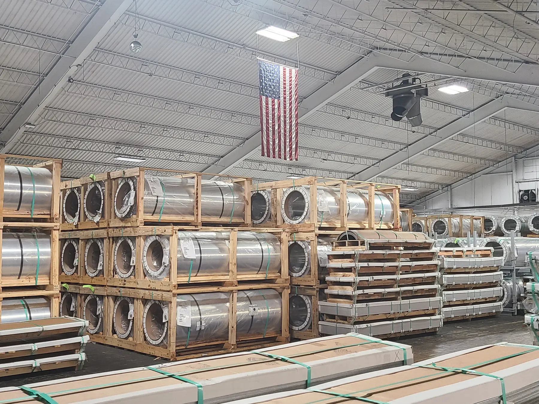 Crated aluminum coils and sheet bundles stored in Rockwell Metals' warehouse