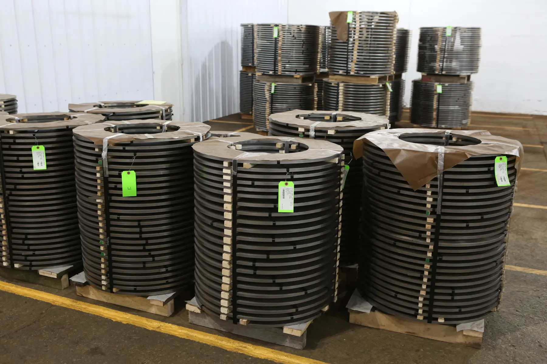 Tagged stacks of narrow slit steel coils on pallets in Salamonie Steel's Bluffton plant