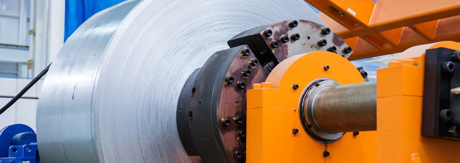 Steel coil loaded on the uncoiler mandrel of a processing line