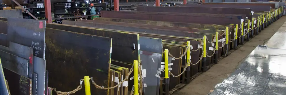 Racks of steel plate standing on edge in Seaport Steel's Seattle yard